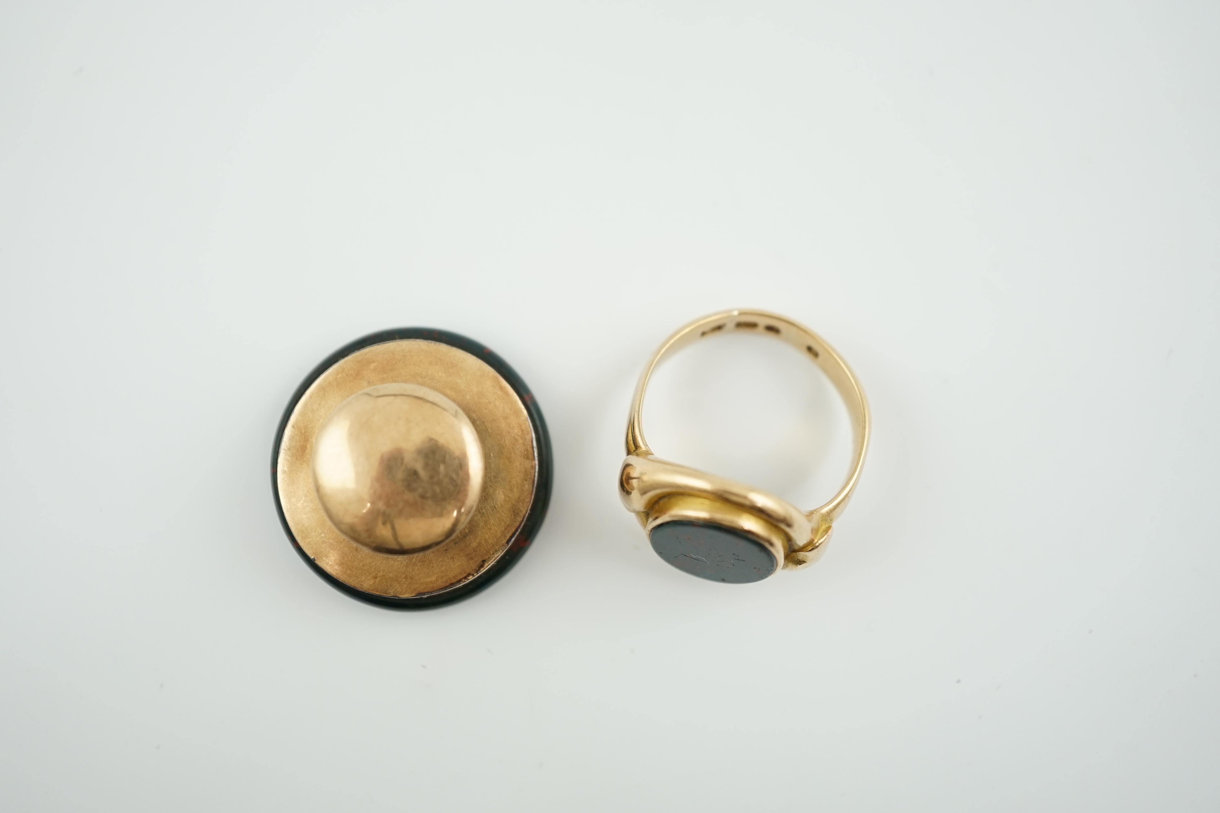 A late Victorian 15ct gold and bloodstone set oval signet ring together with a gold and bloodstone set large dress stud